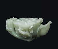 18TH CENTURY A CELADON JADE CARVING OF A LOTUS POD
